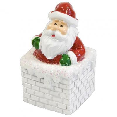 Dek0390 decoration pere noel resine sur sa cheminee
