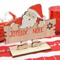 Dek0480 decoration pere noel en bois accoude sur pancarte joyeux noel