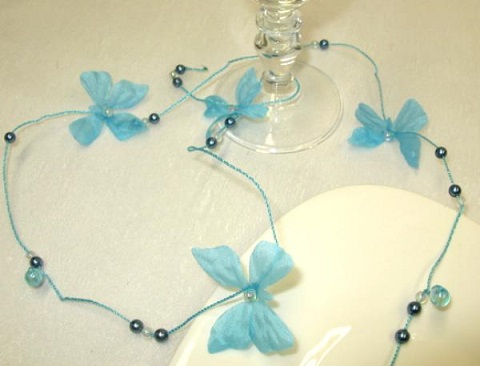 Guirlande papillon et perles bleu turquoise